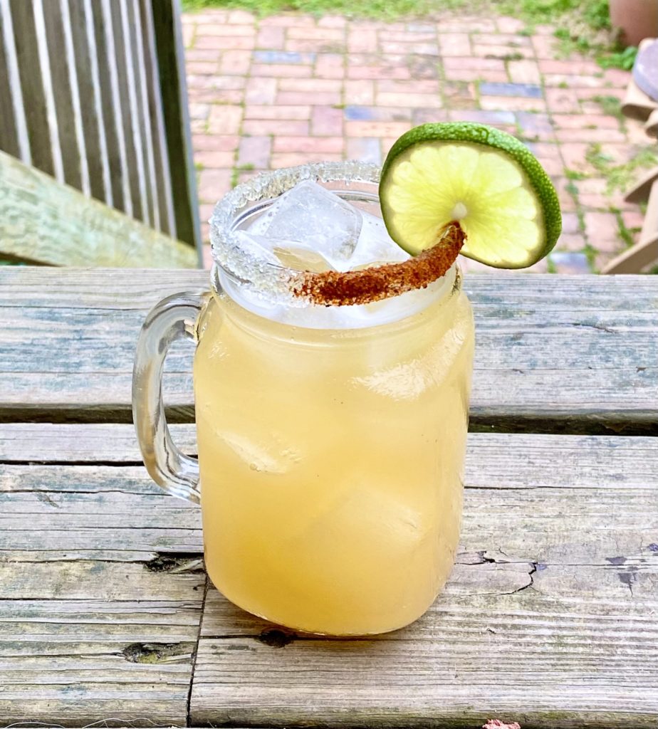 bay rita cocktail with lime on deck