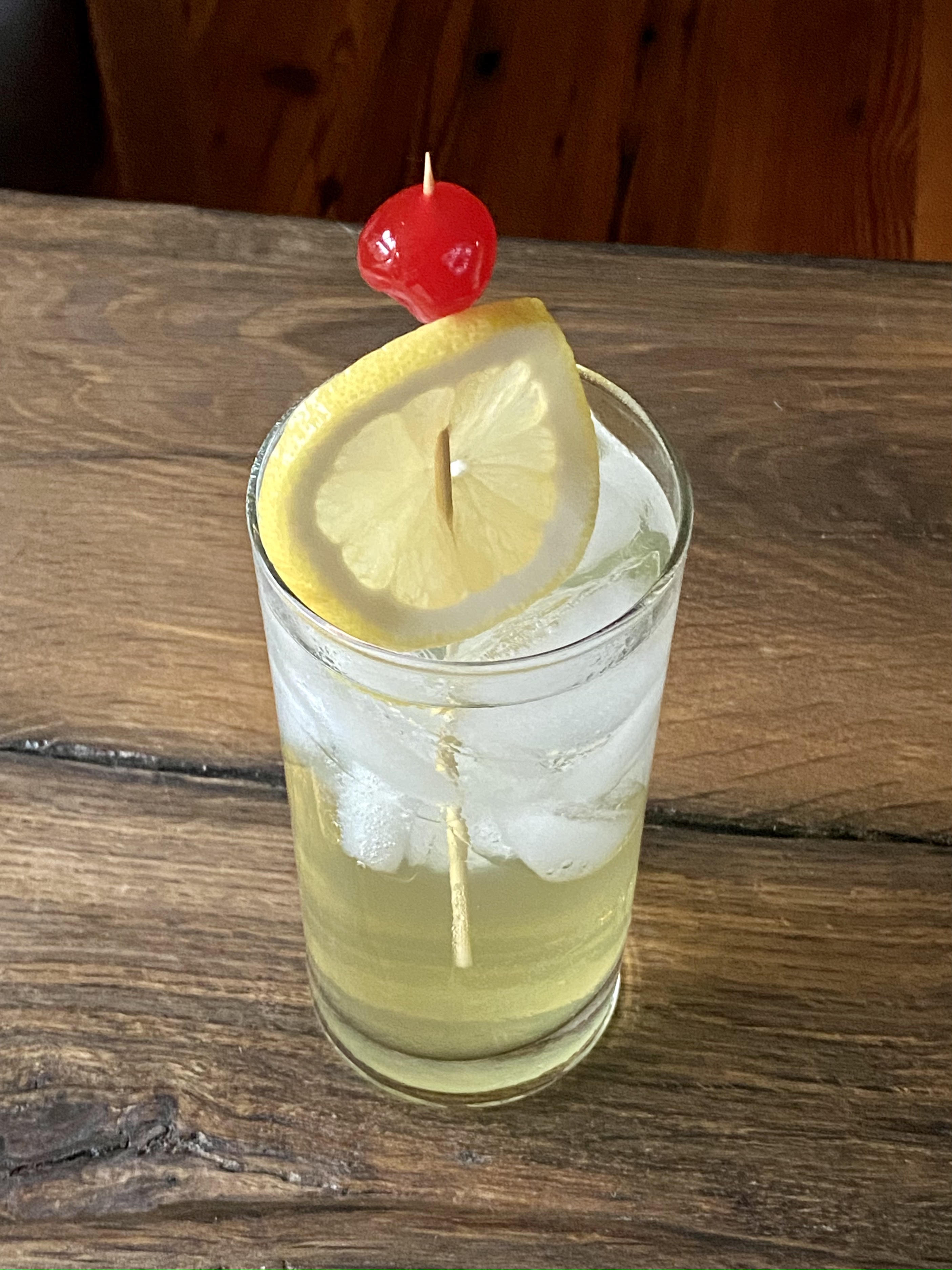 bay vodka collins cocktail with lemon and cherry