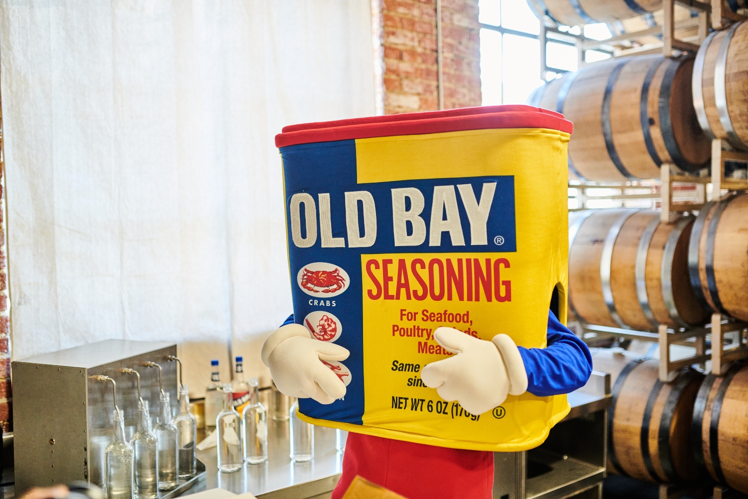 old bay mascot with bottles