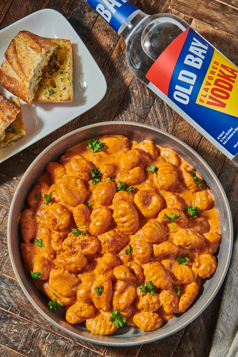 old bay vodka bottle with gnocchi and bread