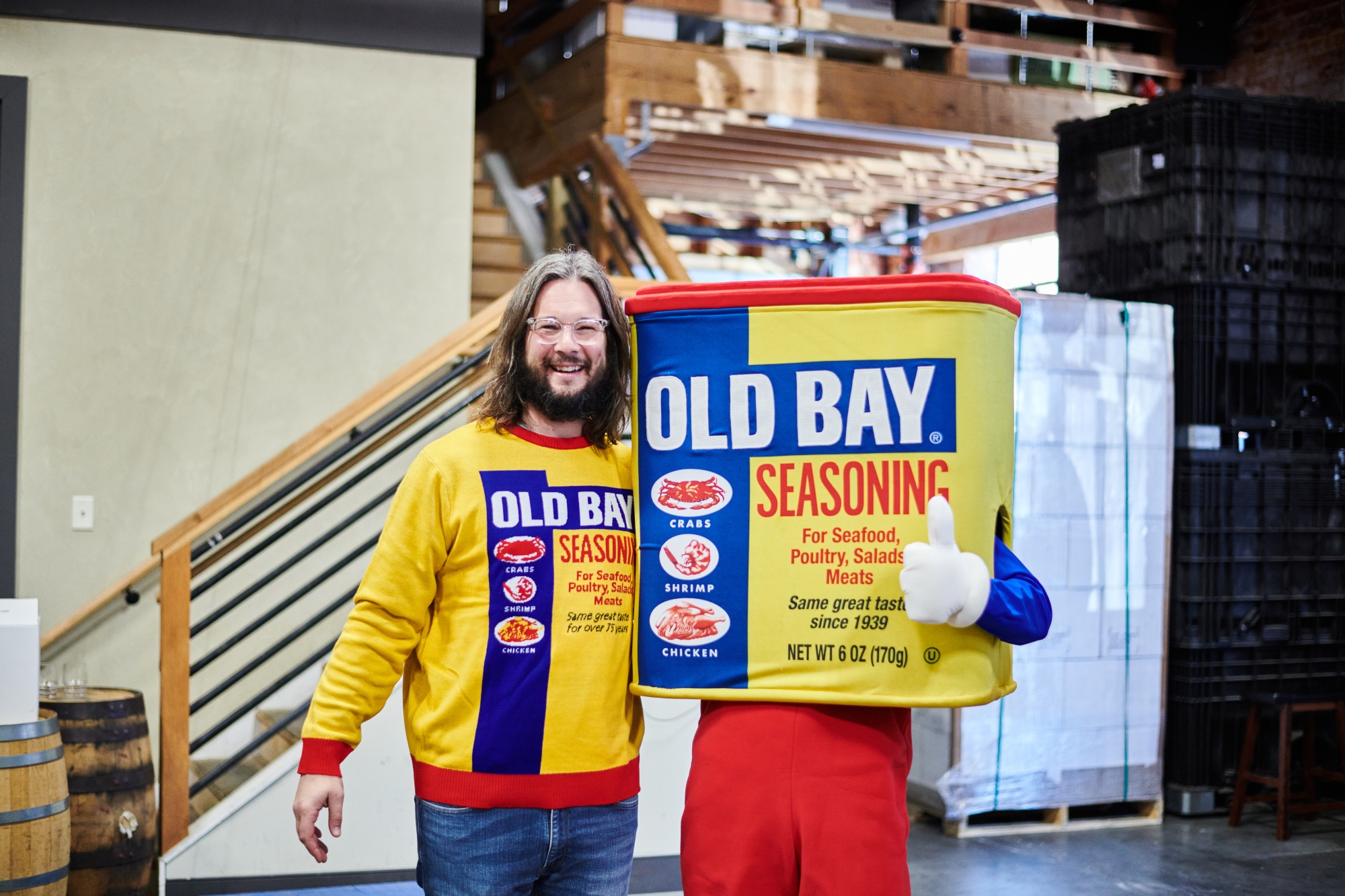 old bay vodka mascot with guy wearing old bay sweater
