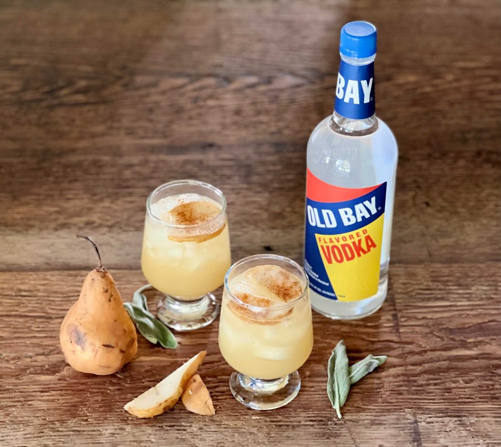 old bay vodka bottle with cocktails and pears