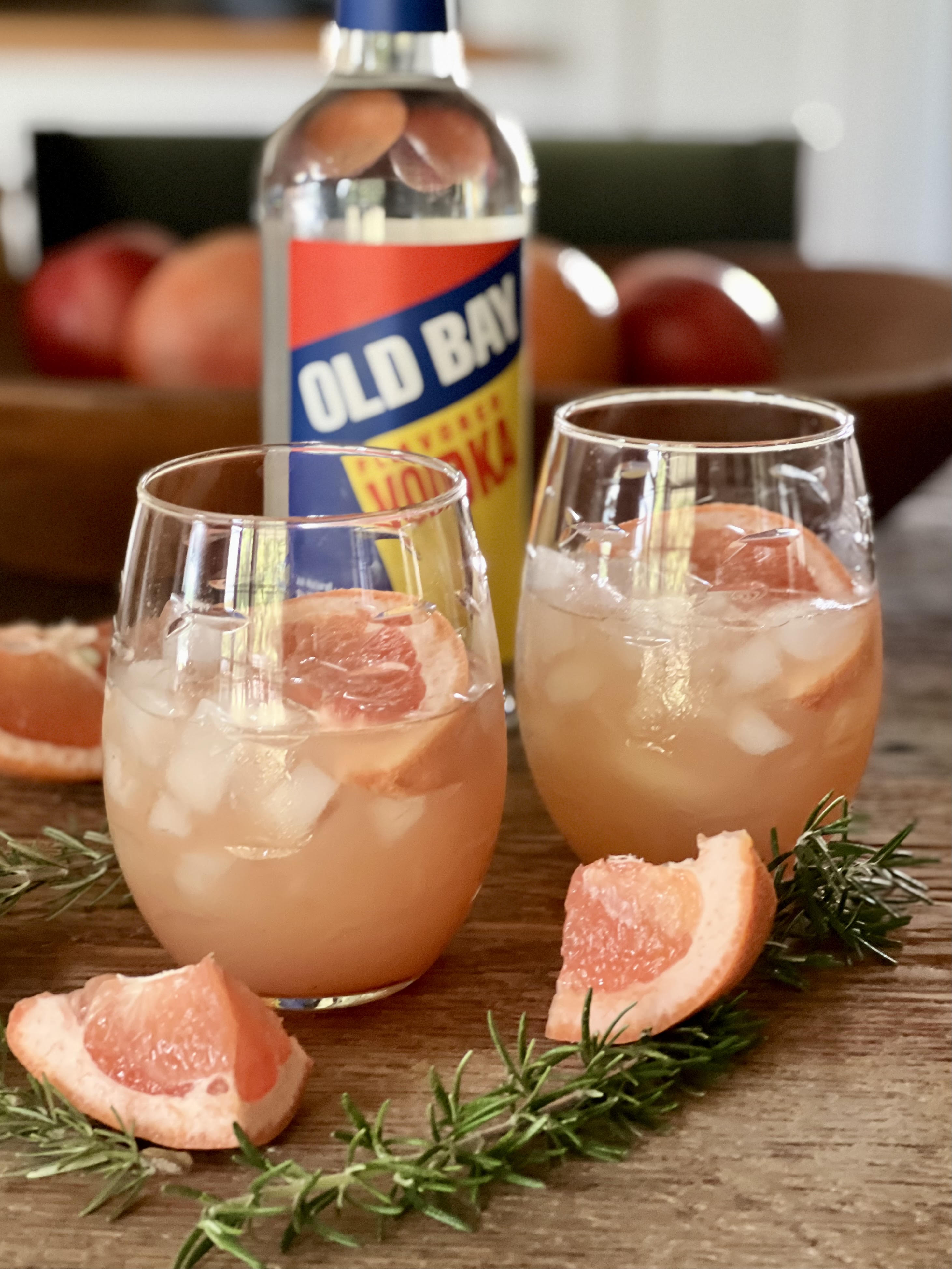 old bay vodka bottle with cocktails and grapefruit
