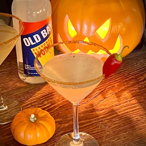 pumpkin with martini and old bay vodka bottle